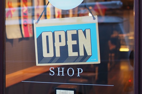 Open sign above shop letters